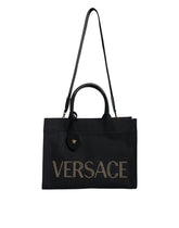 Bolsa transversal Versace preta com alça superior em couro e lona com logotipo