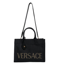 Bolsa transversal Versace preta com alça superior em couro e lona com logotipo
