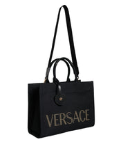 Bolsa transversal Versace preta com alça superior em couro e lona com logotipo