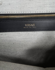 Bolsa transversal Versace branca com alça superior em couro e lona com logotipo