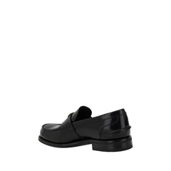 Mocassins Prada com placa triangular