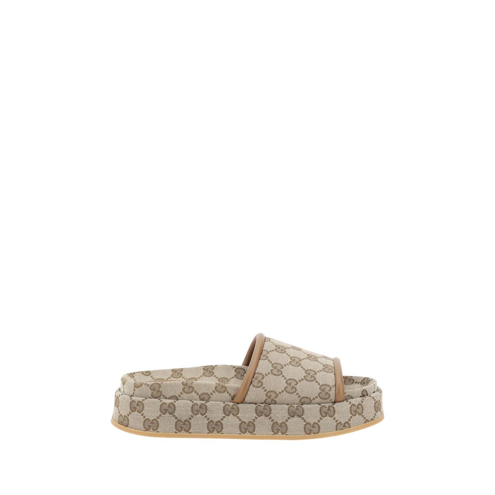 Sandálias plataforma com padrão Gucci GG