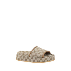 Sandálias plataforma com padrão Gucci GG